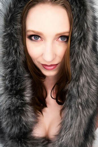 Boudoir portrait of a woman wearing fur